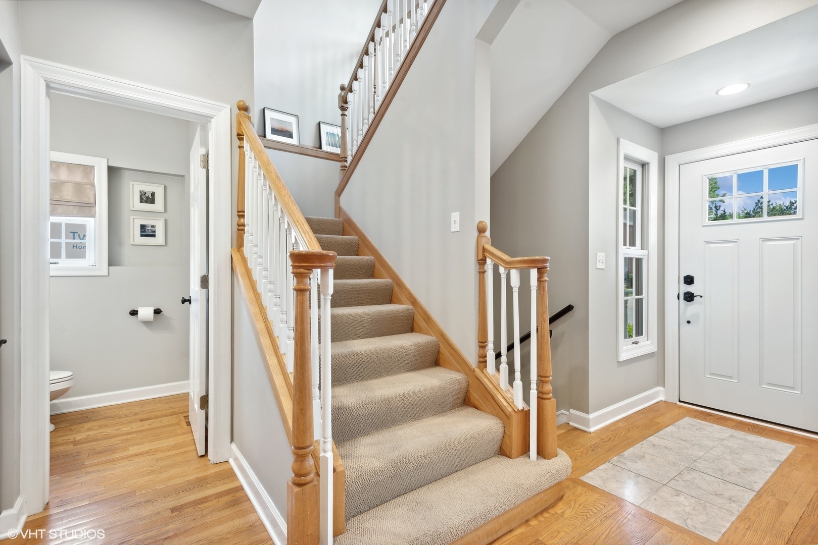 2320 Illinois Road Northbrook, IL 60062 - Photo 3 of 36 a view of a hallway with wooden floor and staircase