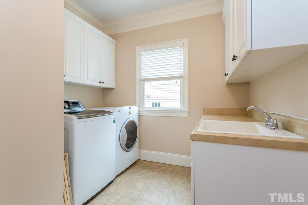 2313 Finley Ridge Lane Raleigh, NC 27615 - Photo 14 of 25 a utility room with dryer and washer