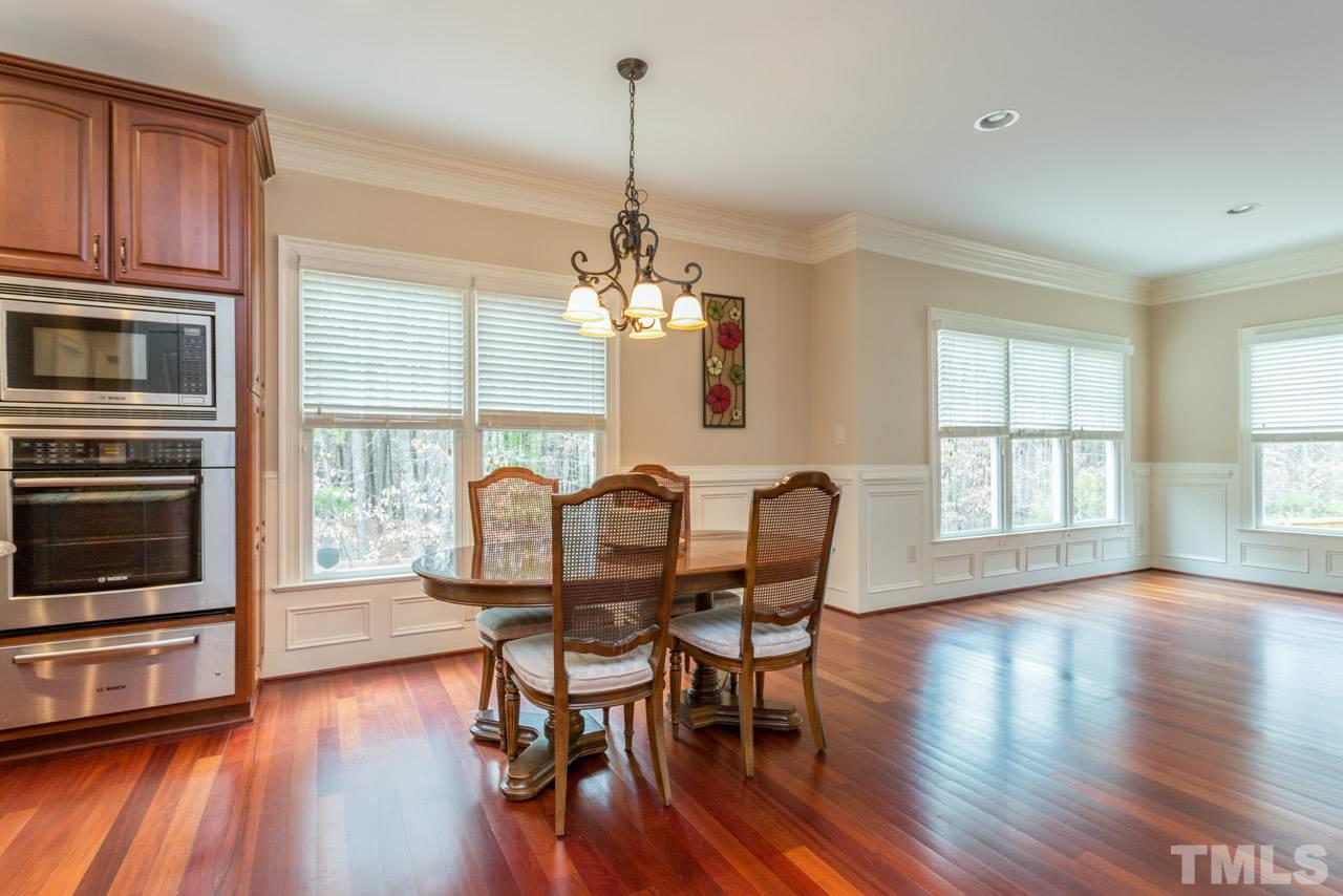 2313 Finley Ridge Lane Raleigh, NC 27615 - Photo 8 of 25 a view of a dining room with furniture window and wooden floor