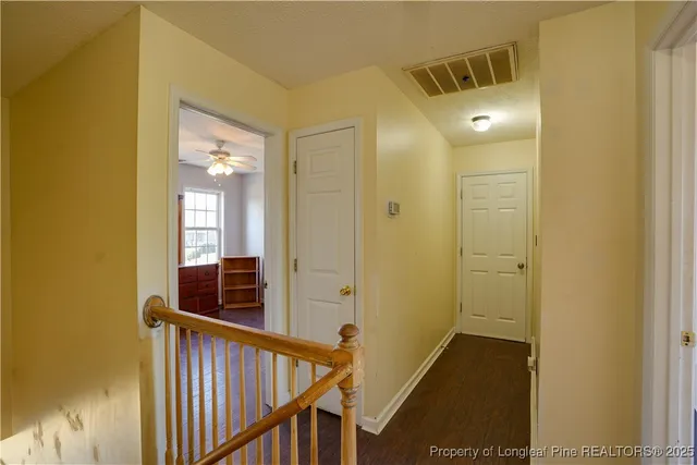 a bathroom with a shower curtain and a sink