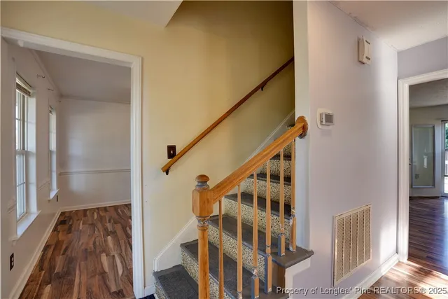 a kitchen with stainless steel appliances a stove top oven a sink and a refrigerator