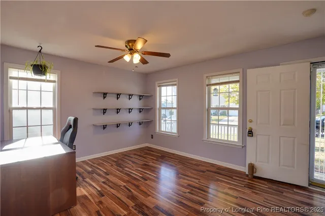 a kitchen with a sink stainless steel appliances cabinets and a counter top space
