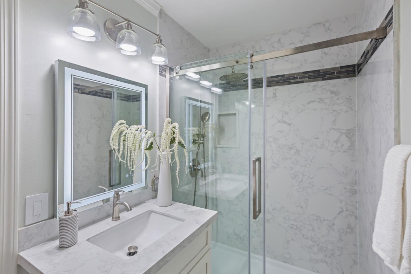 22856 Poplar Grove Square Cupertino, CA 95014 - Photo 15 of 82 a bathroom with a shower sink and mirror