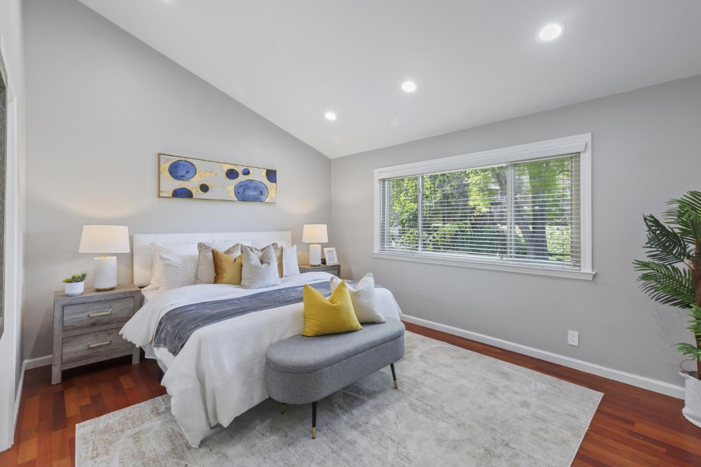 22856 Poplar Grove Square Cupertino, CA 95014 - Photo 17 of 82 a spacious bedroom with a bed and a window