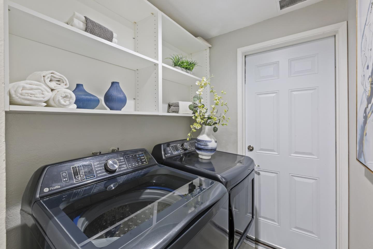 22856 Poplar Grove Square Cupertino, CA 95014 - Photo 24 of 82 a kitchen with a stove and a refrigerator