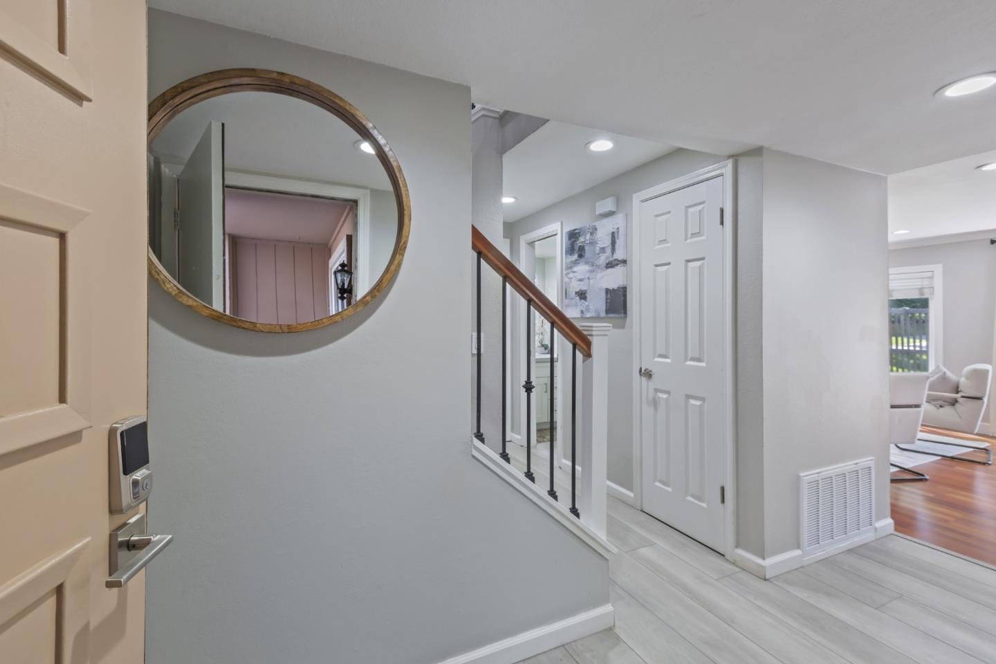 22856 Poplar Grove Square Cupertino, CA 95014 - Photo 32 of 82 a view of a livingroom with wooden floor and entryway