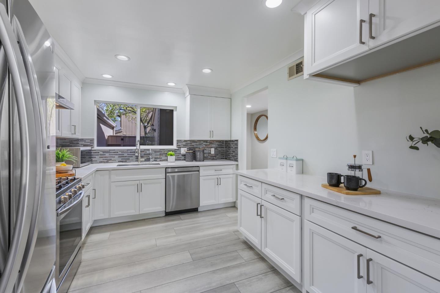 22856 Poplar Grove Square Cupertino, CA 95014 - Photo 7 of 82 a kitchen with white cabinets and sink