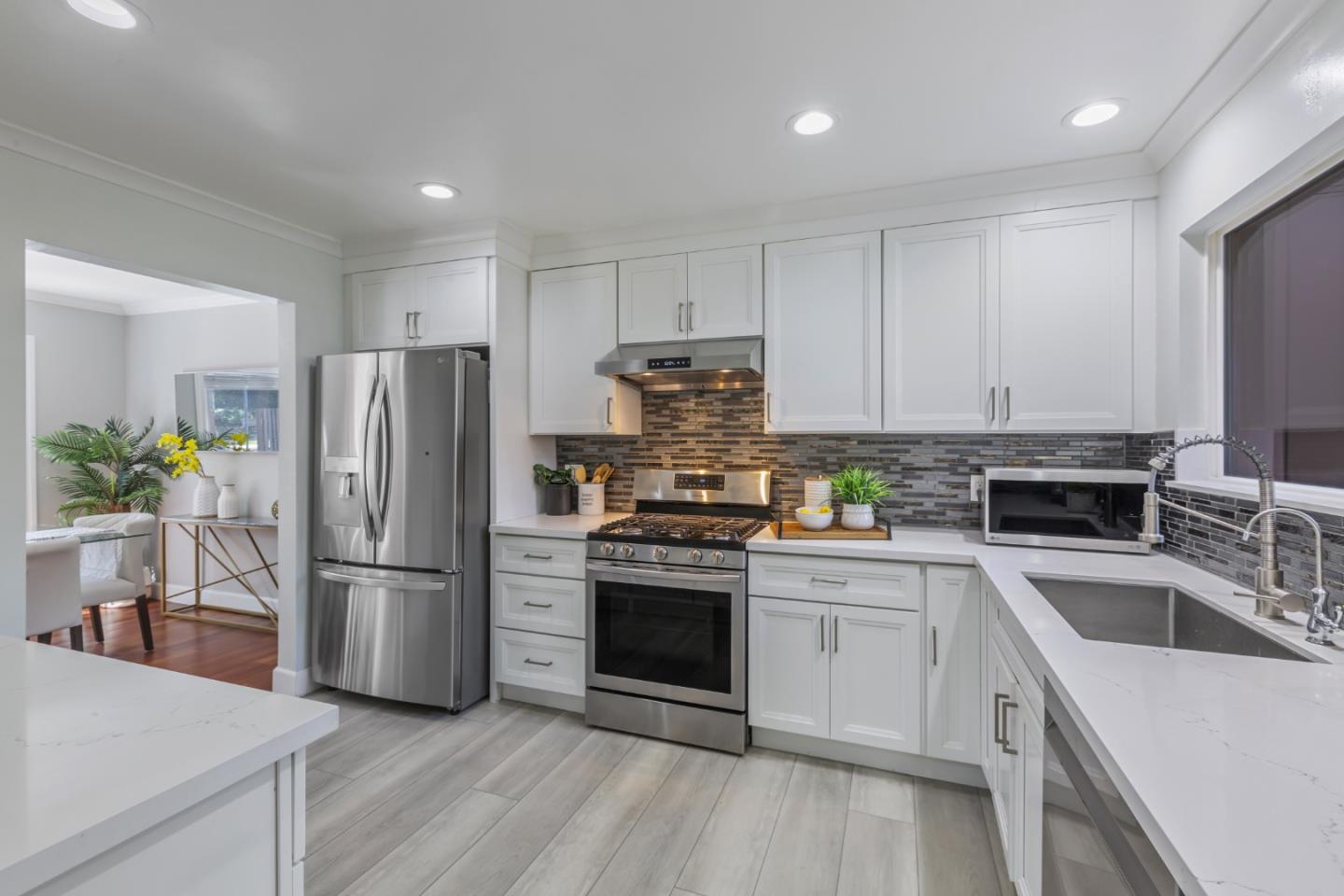 22856 Poplar Grove Square Cupertino, CA 95014 - Photo 8 of 82 a kitchen with a refrigerator sink and stainless steel appliances