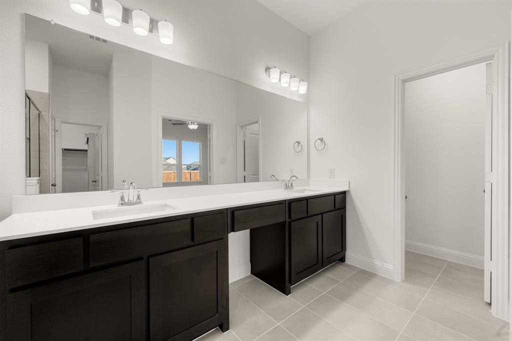 4357 Noble Lane Midlothian, TX 76065 - Photo 13 of 31 a bathroom with a double vanity sink and a mirror