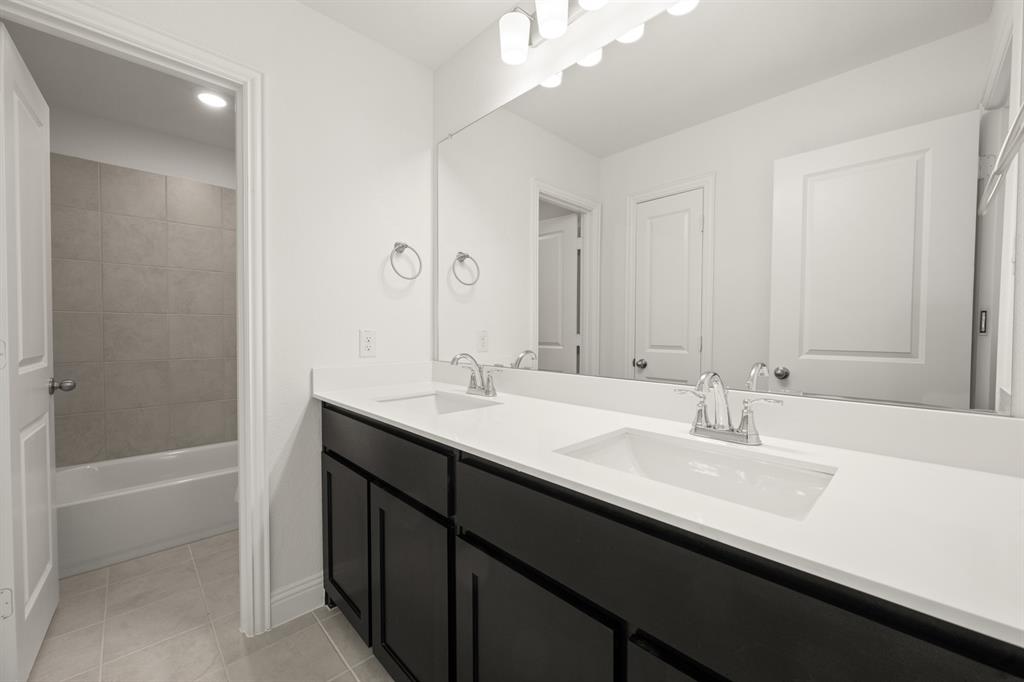 4357 Noble Lane Midlothian, TX 76065 - Photo 22 of 31 a bathroom with a sink a tub and a mirror