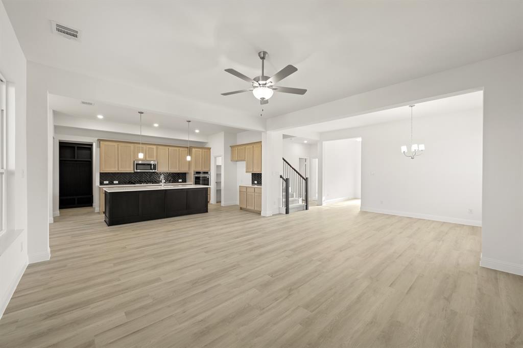 4357 Noble Lane Midlothian, TX 76065 - Photo 6 of 31 a view of an empty room with kitchen and kitchen view
