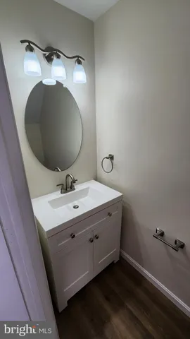 a bathroom with a sink and mirror