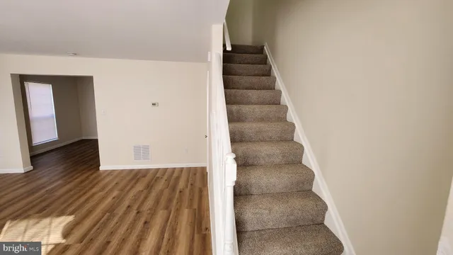 a view of entryway with wooden floor