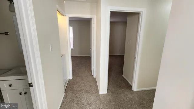 a view of a bathroom from a hallway