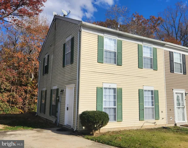 a front view of a house with yard