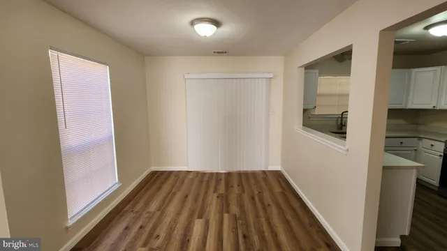 a view of a kitchen from the hallway