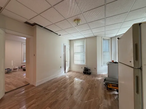 a view of a livingroom with wooden floor