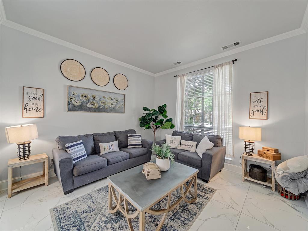 4332 Millsop Drive Carrollton, TX 75010 - Photo 13 of 37 a living room with furniture and a table