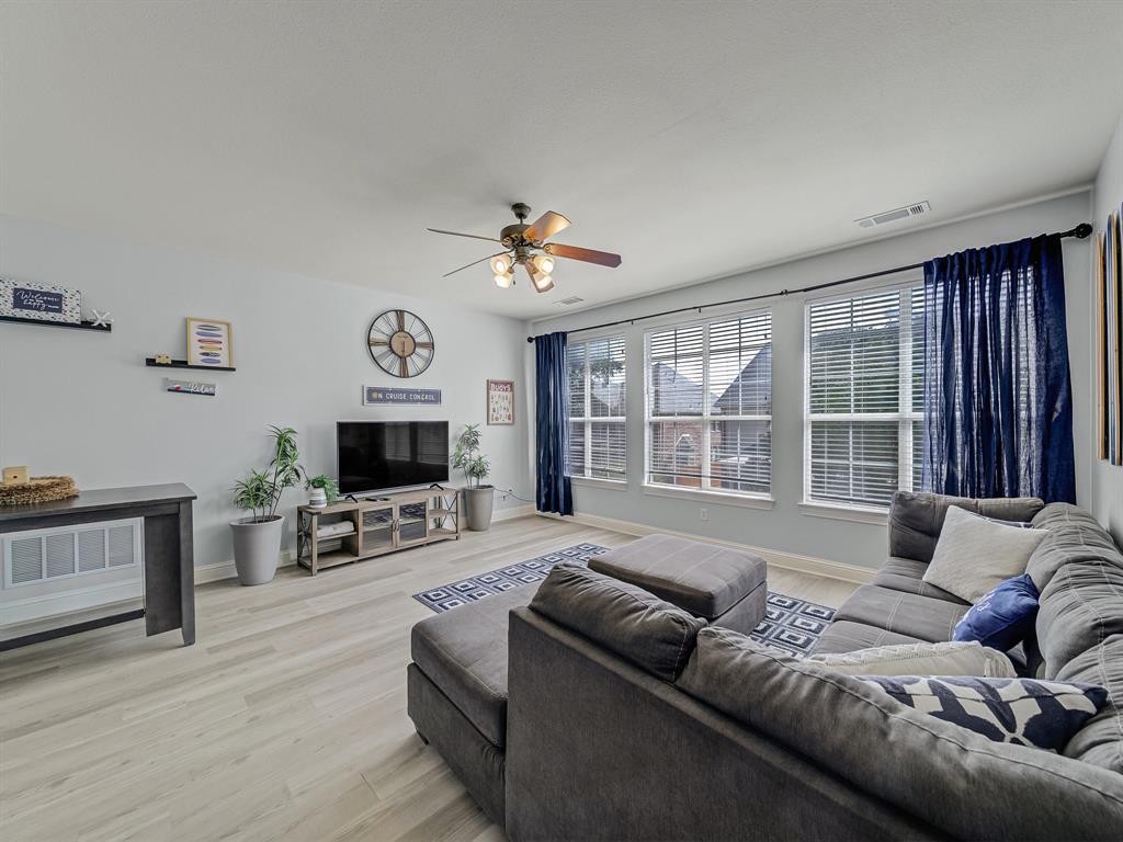 4332 Millsop Drive Carrollton, TX 75010 - Photo 2 of 37 a living room with furniture and a flat screen tv