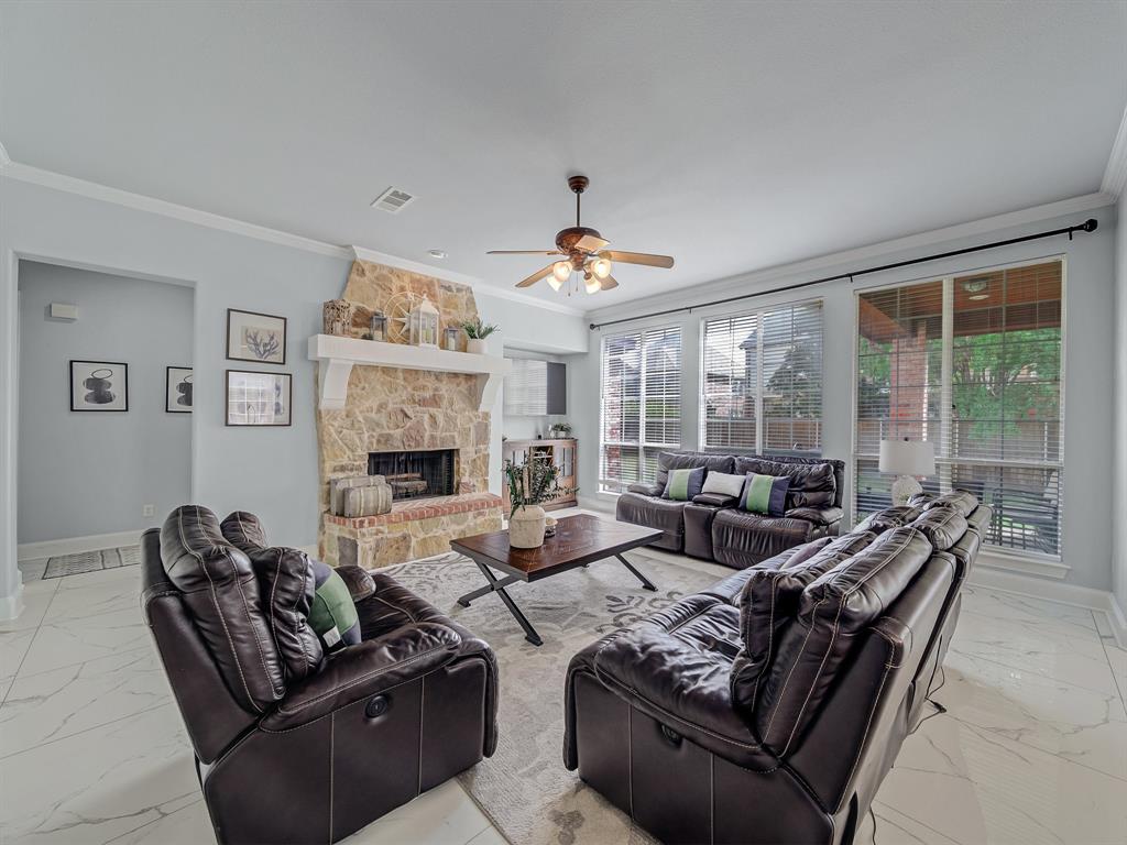 4332 Millsop Drive Carrollton, TX 75010 - Photo 22 of 37 a living room with furniture and a fireplace