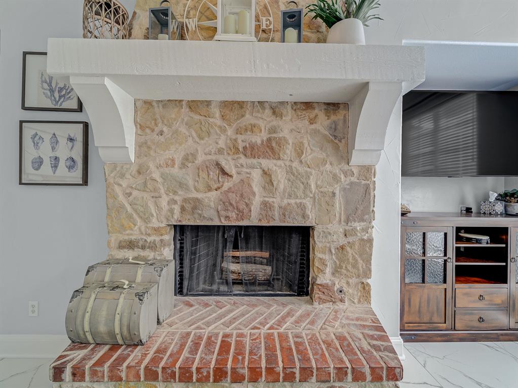 4332 Millsop Drive Carrollton, TX 75010 - Photo 24 of 37 a bedroom with a fireplace and a fireplace