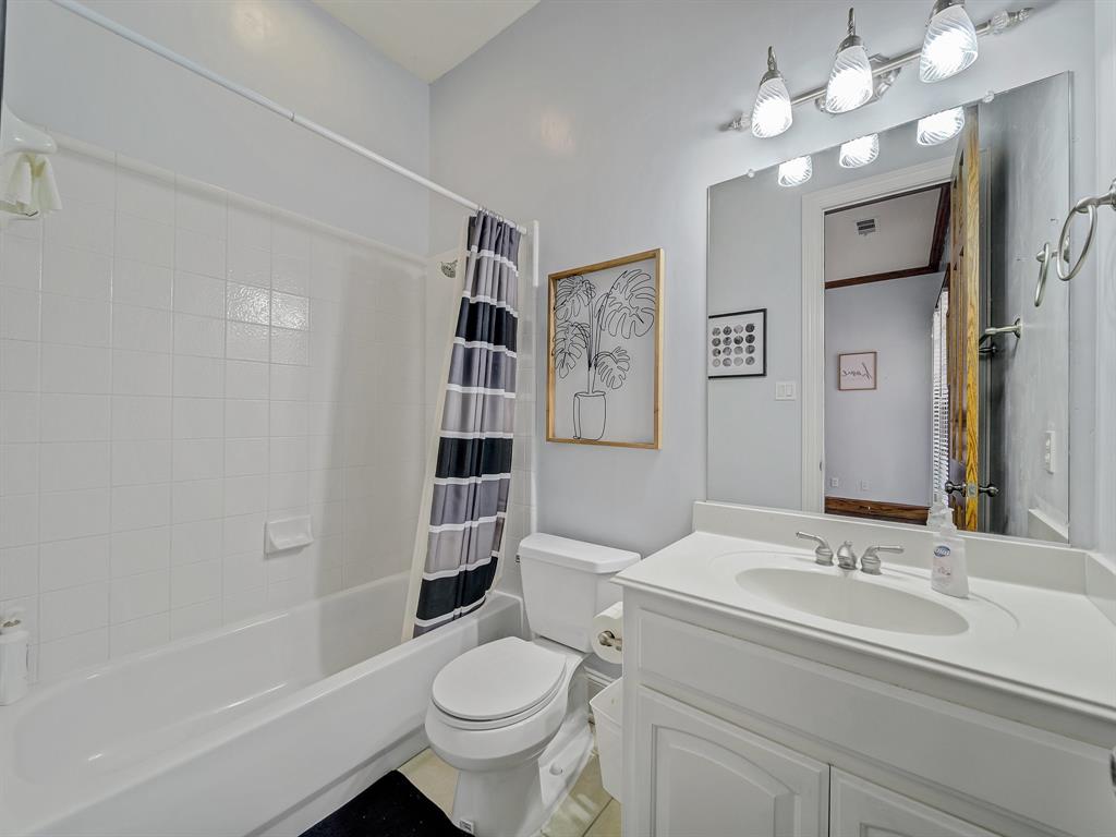 4332 Millsop Drive Carrollton, TX 75010 - Photo 26 of 37 a bathroom with a sink toilet tub and shower