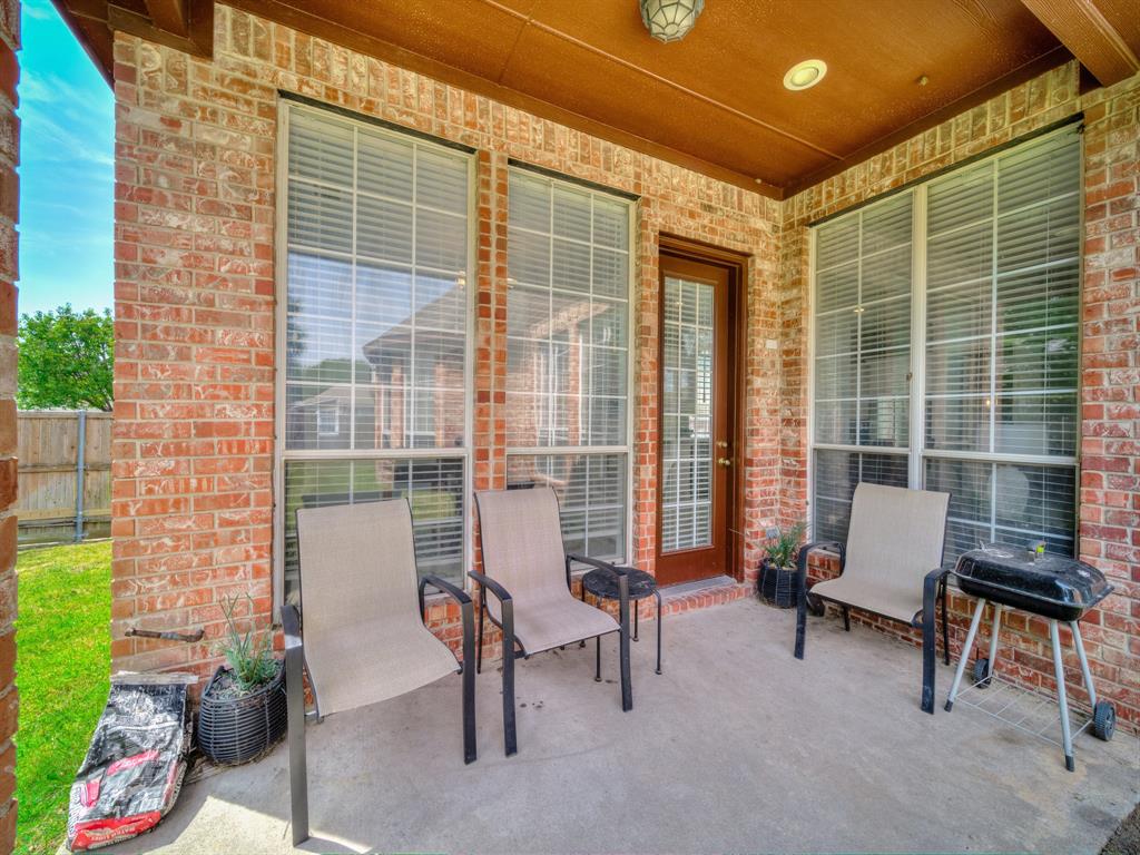4332 Millsop Drive Carrollton, TX 75010 - Photo 30 of 37 a living room with furniture and a window