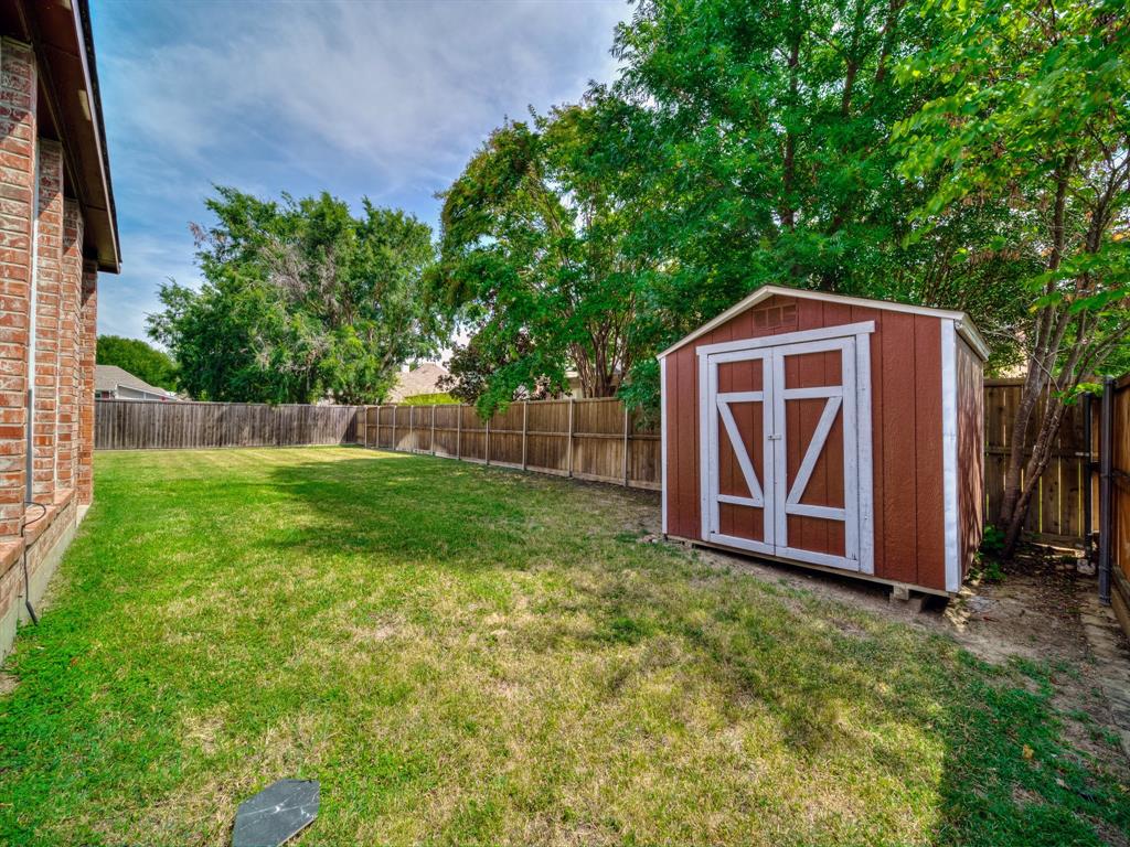 4332 Millsop Drive Carrollton, TX 75010 - Photo 31 of 37 a front view of a house with garden