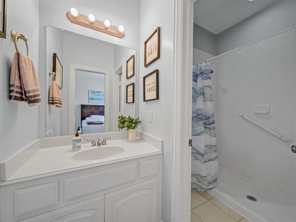 4332 Millsop Drive Carrollton, TX 75010 - Photo 5 of 37 a bathroom with a shower sink and mirror