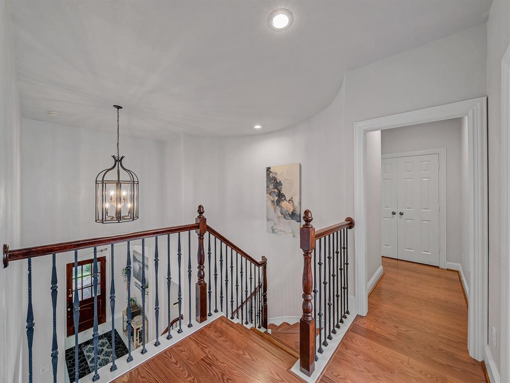4332 Millsop Drive Carrollton, TX 75010 - Photo 9 of 37 a view of a hallway with wooden floor and stairs