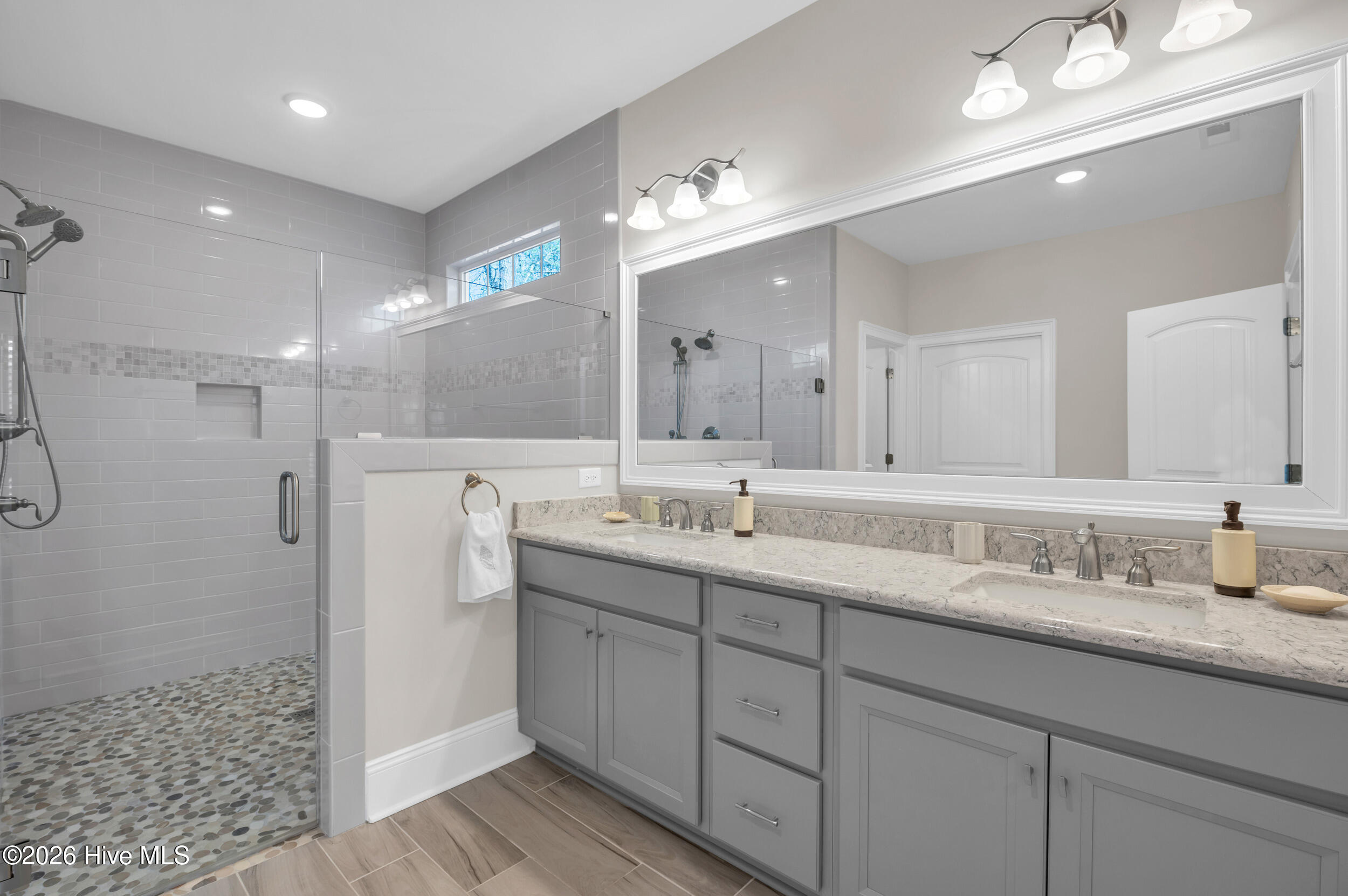 9614 Hidden Plum Road Northeast Leland, NC 28451 - Photo 17 of 53 Primary bath with large walk in shower & toilet closet