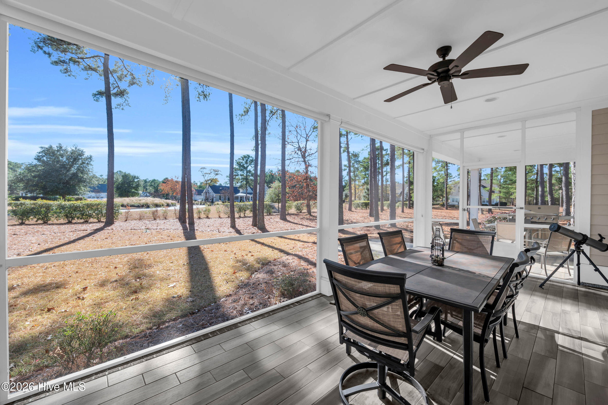 9614 Hidden Plum Road Northeast Leland, NC 28451 - Photo 29 of 53 Screened porch with tile floor and ceiling fan