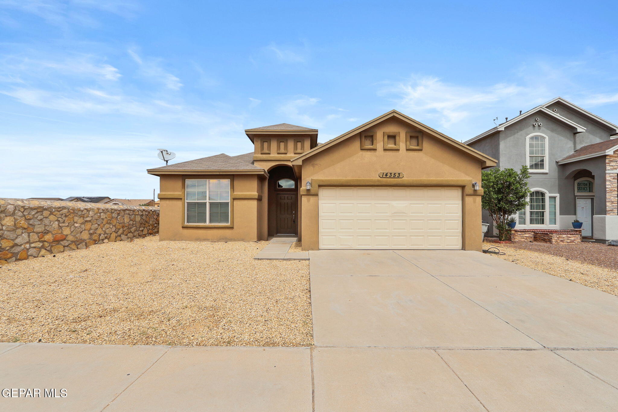 14353 Arabian Point El Paso, TX 79938 - Photo 1 of 48 a front view of a house with a yard and garage