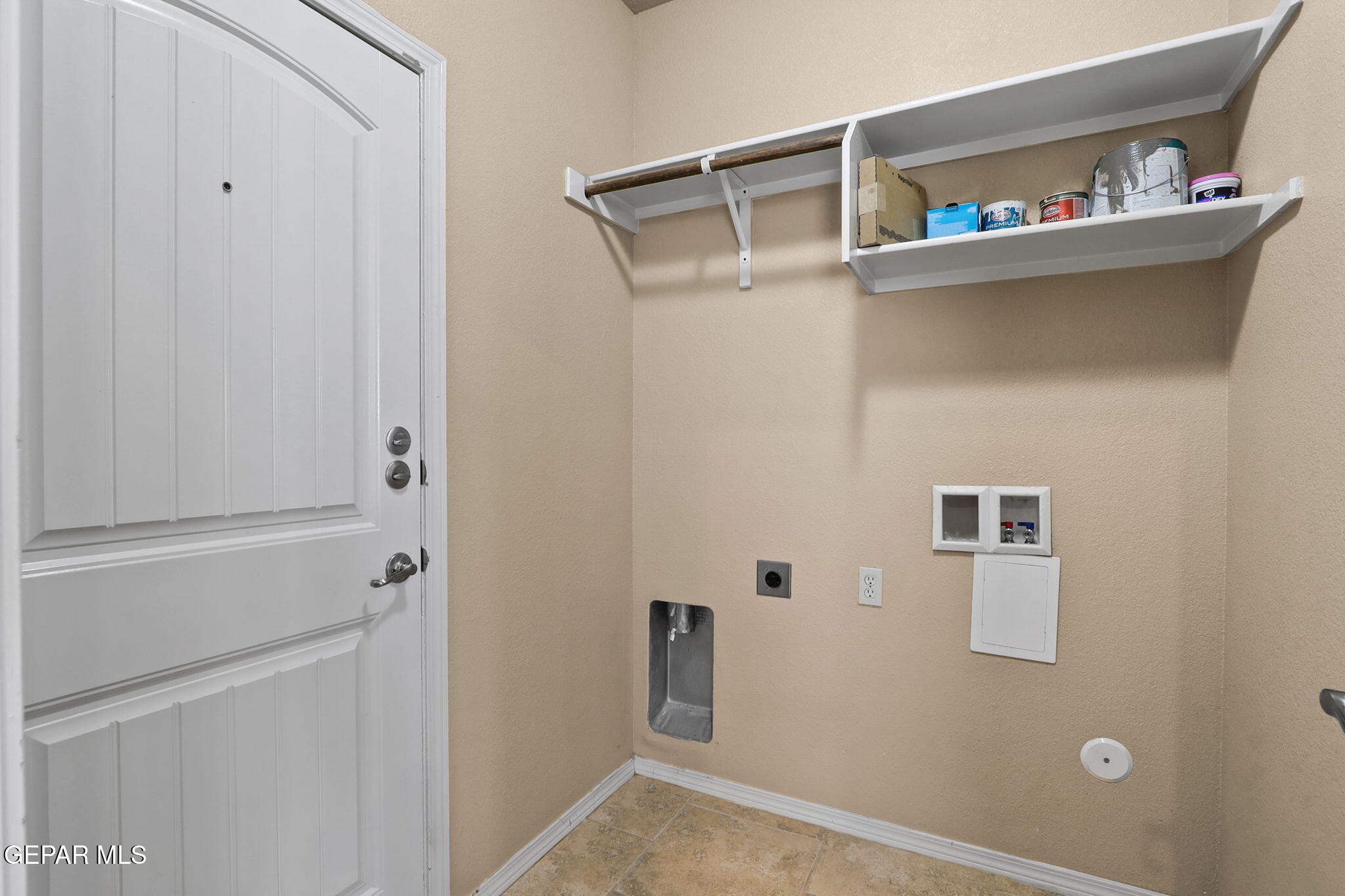 14353 Arabian Point El Paso, TX 79938 - Photo 32 of 48 a view of storage and utility room with washer and dryer
