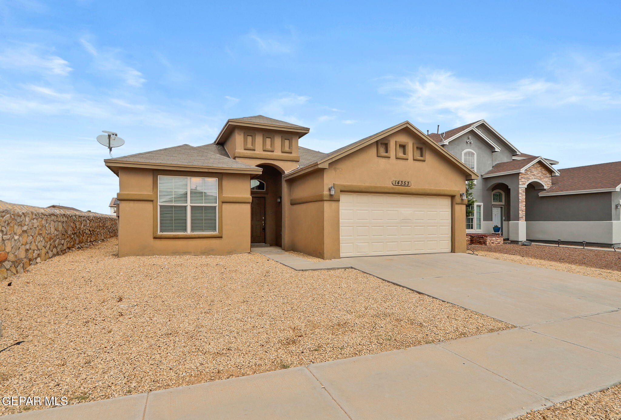 14353 Arabian Point El Paso, TX 79938 - Photo 37 of 48 a front view of a house with a yard and garage