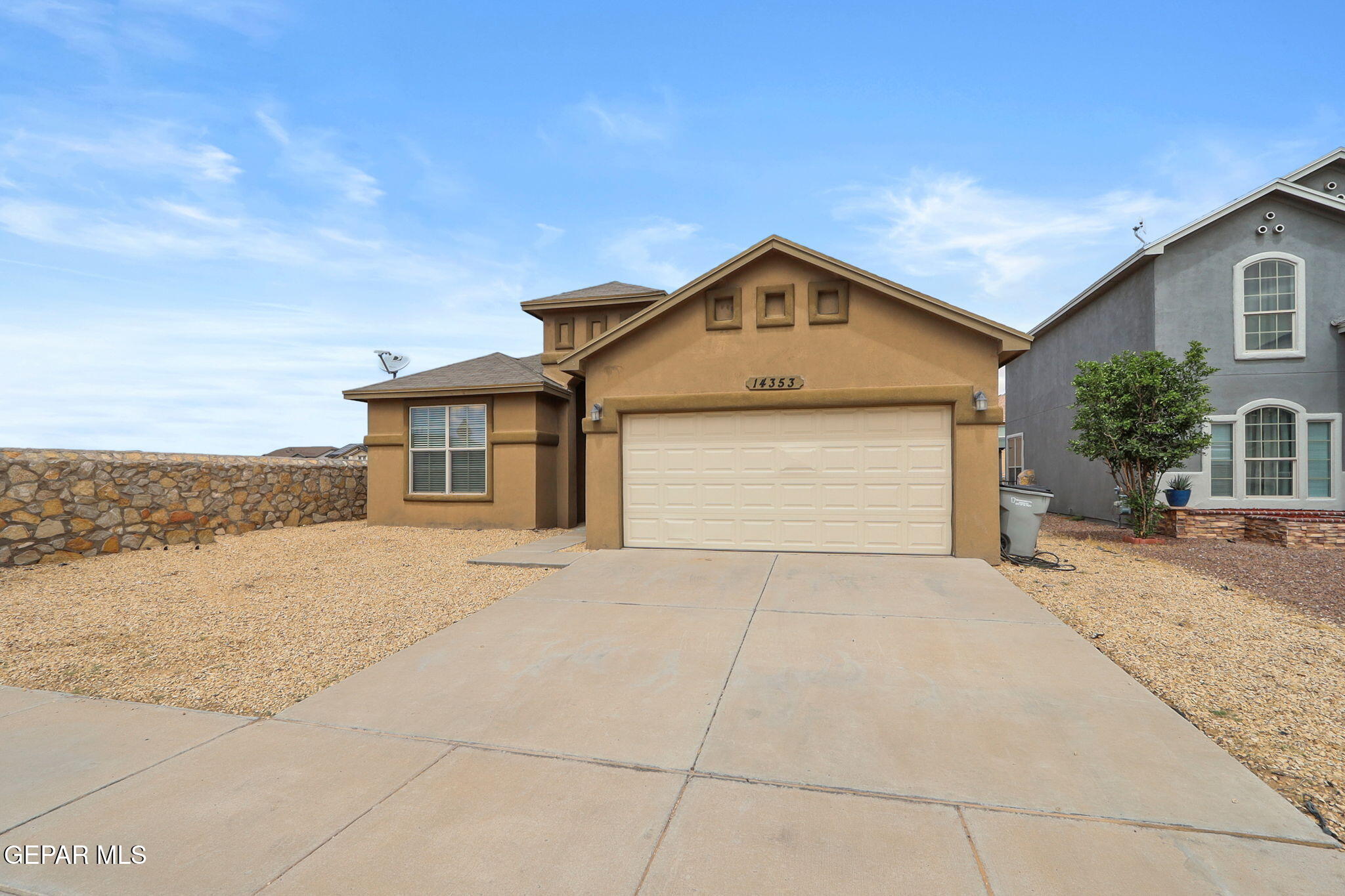 14353 Arabian Point El Paso, TX 79938 - Photo 38 of 48 a front view of a house with a yard and garage