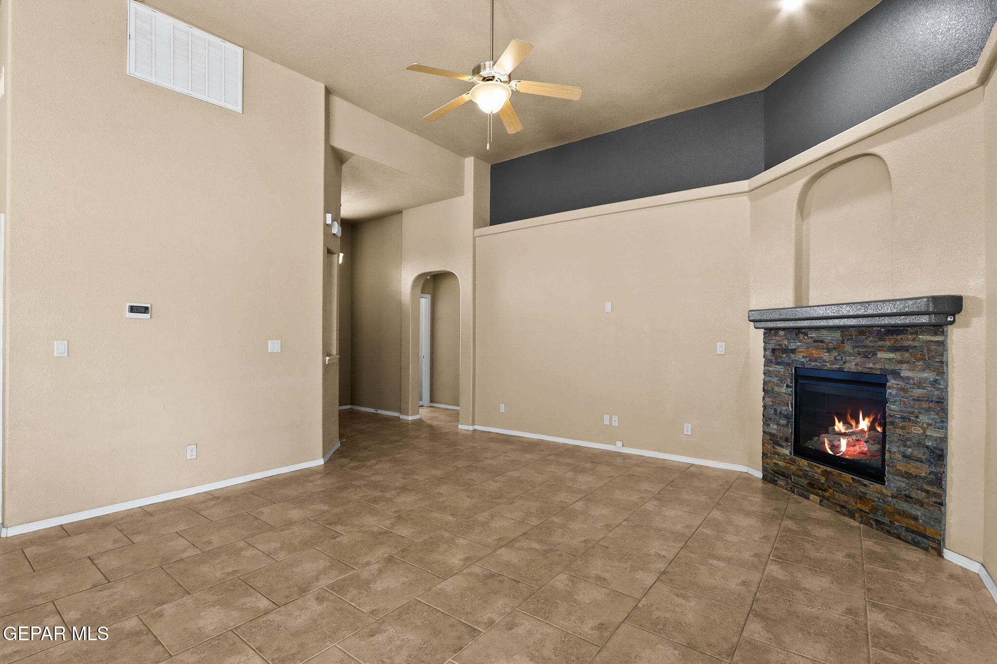 14353 Arabian Point El Paso, TX 79938 - Photo 4 of 48 a view of an empty room with a fireplace