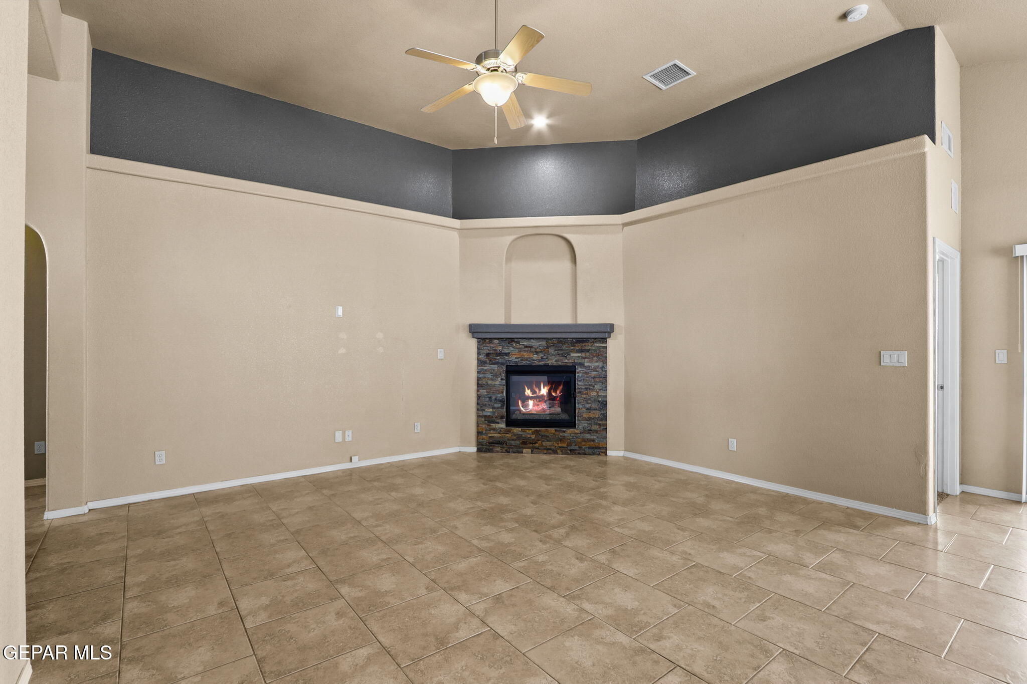 14353 Arabian Point El Paso, TX 79938 - Photo 6 of 48 a view of an empty room with a fireplace
