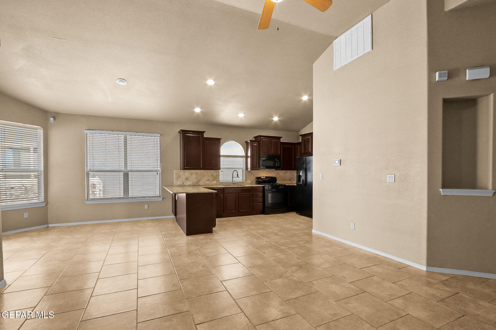 14353 Arabian Point El Paso, TX 79938 - Photo 7 of 48 a large space with a large window and kitchen view