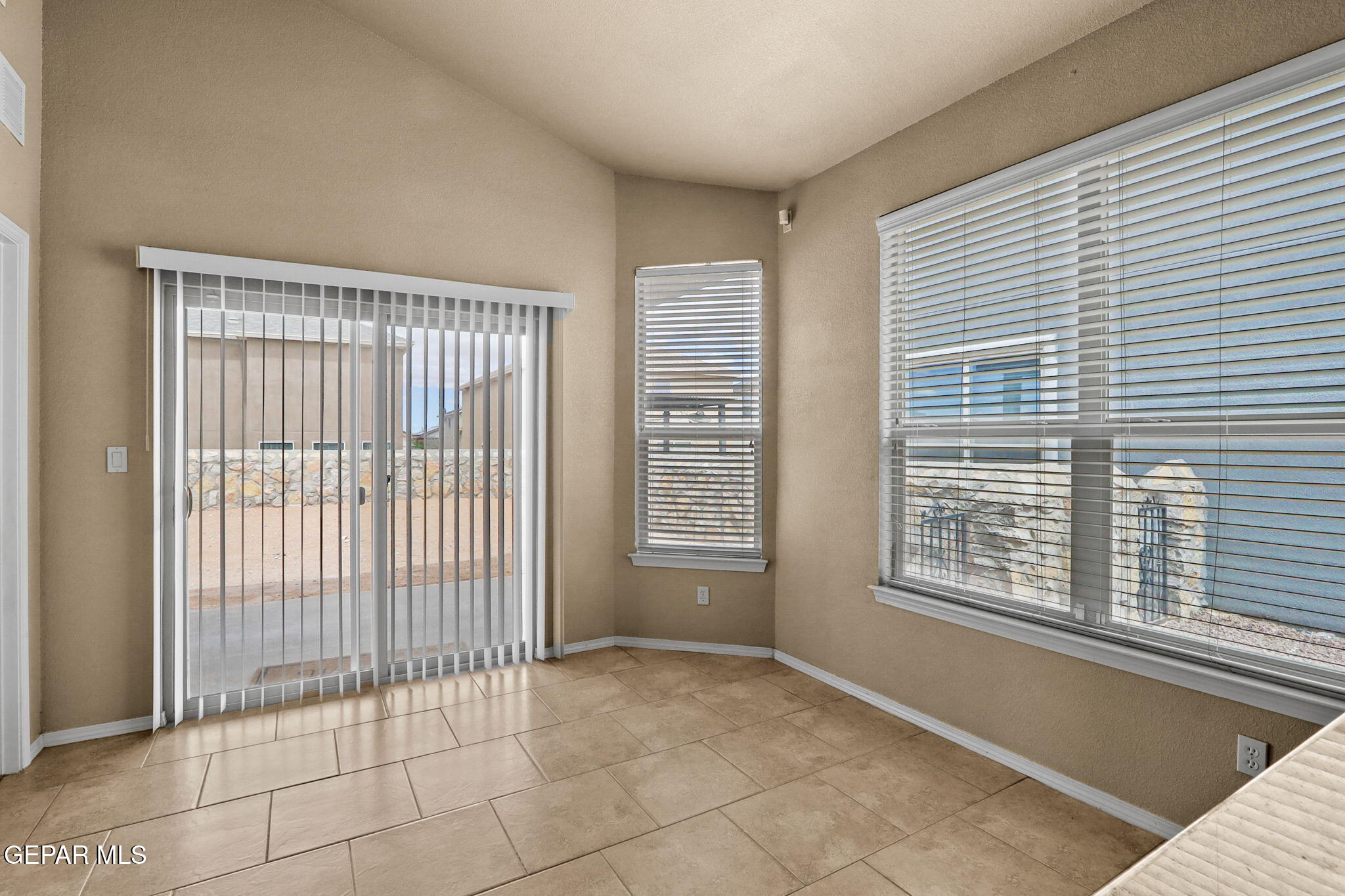 14353 Arabian Point El Paso, TX 79938 - Photo 10 of 48 a view of an empty room with a window