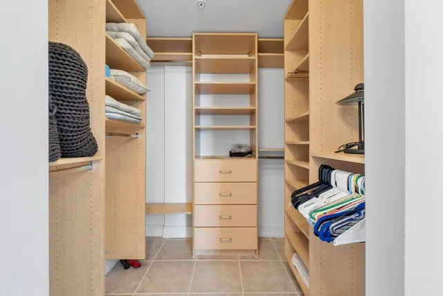a bathroom with a sink a vanity and a large mirror
