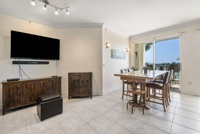 a view of a livingroom with furniture and a flat screen tv