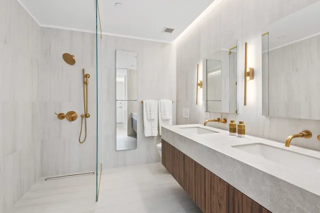 a bedroom with a bed and a potted plant