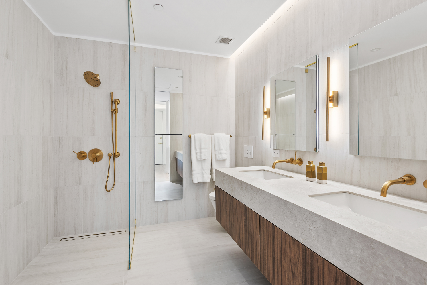 330 Grand Street, Unit 2B Manhattan, NY 10002 - Photo 4 of 16 a bathroom with a double vanity sink mirror and shower