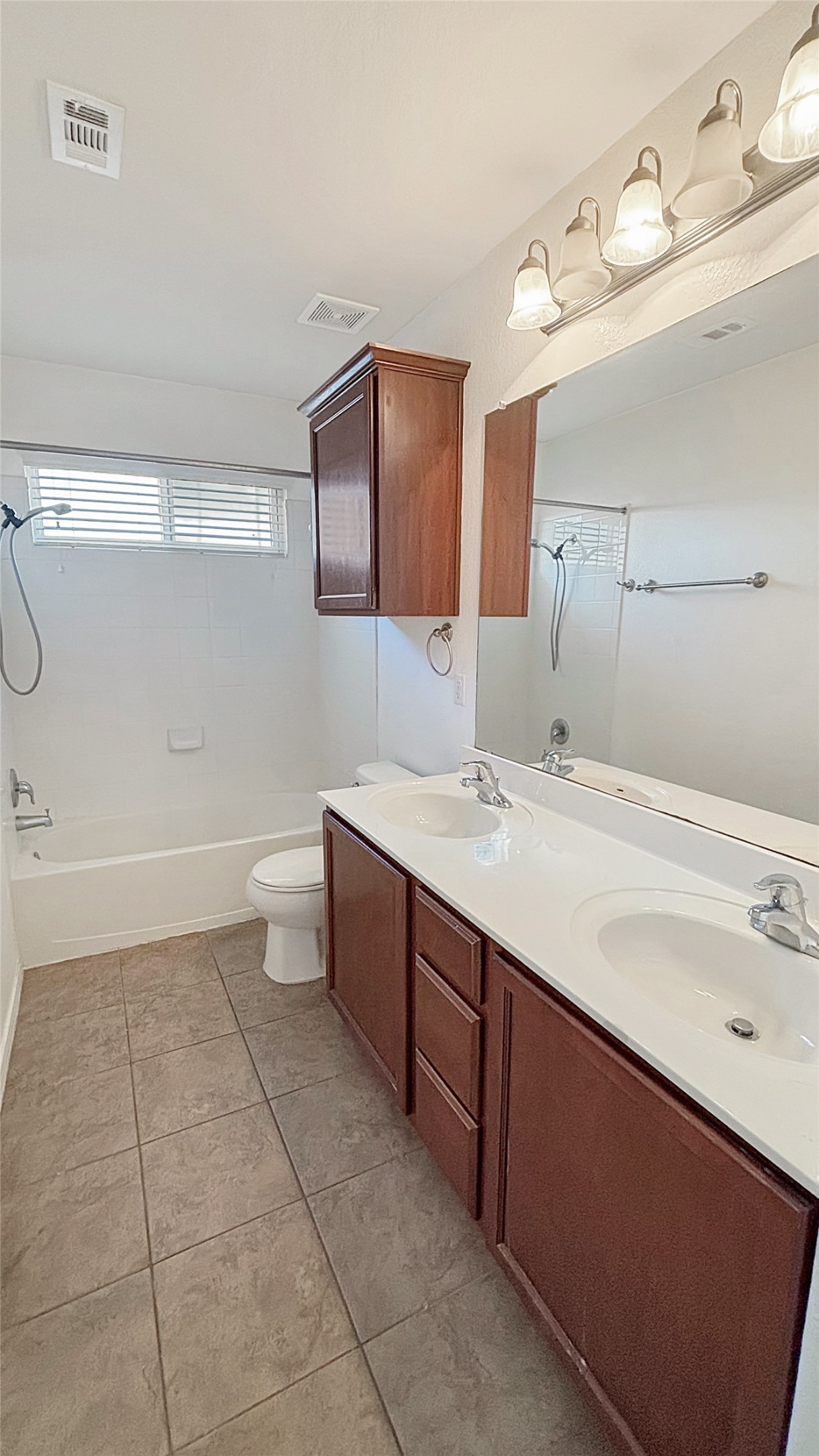 133 Langtry Lane Jarrell, TX 76537 - Photo 17 of 28 Full bath upstairs with double sinks and tub/shower combo. Plenty of space and storage.