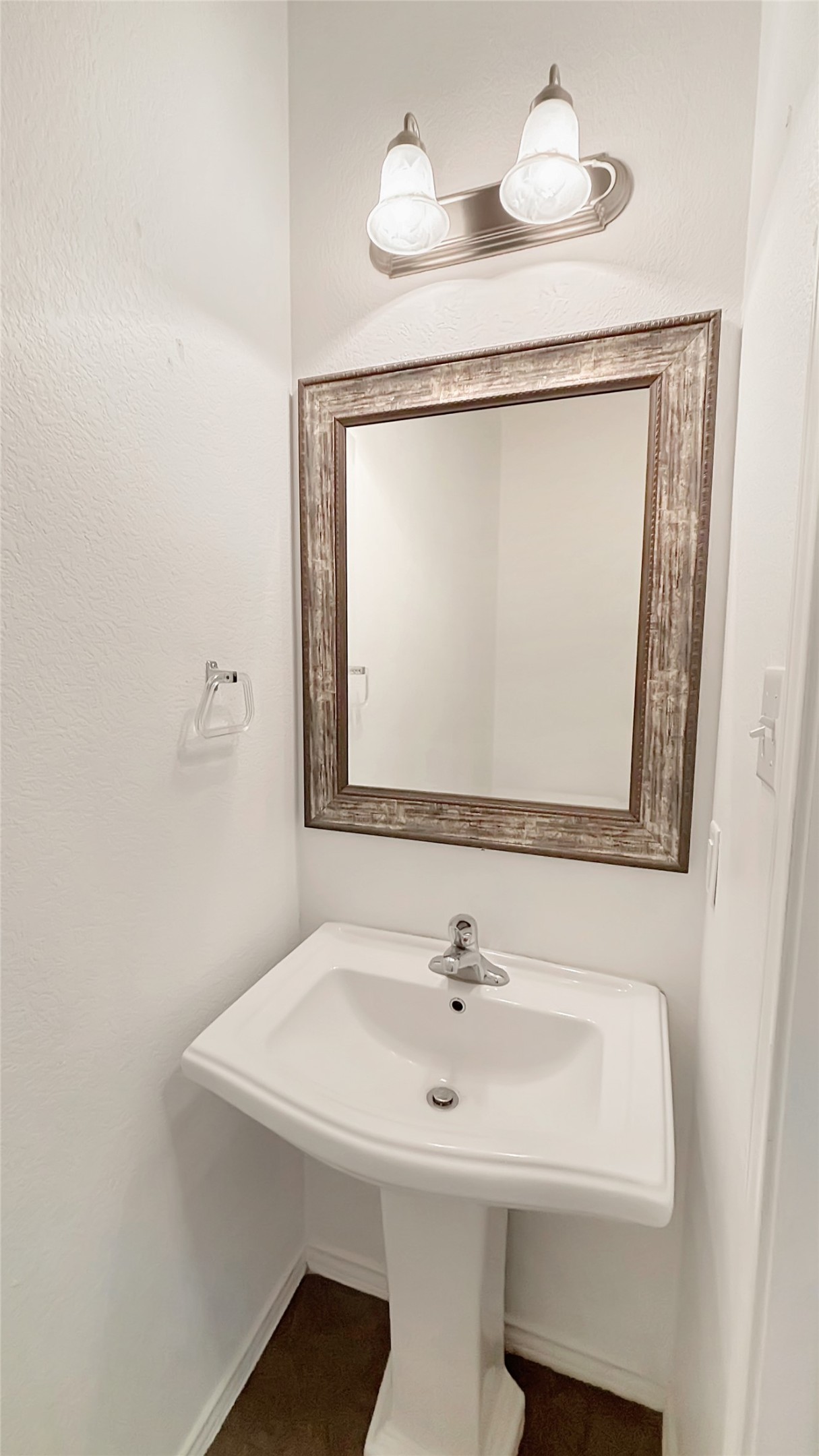 133 Langtry Lane Jarrell, TX 76537 - Photo 27 of 28 1/2 bathroom downstairs just off of the living room and close to the garage for your convenience.