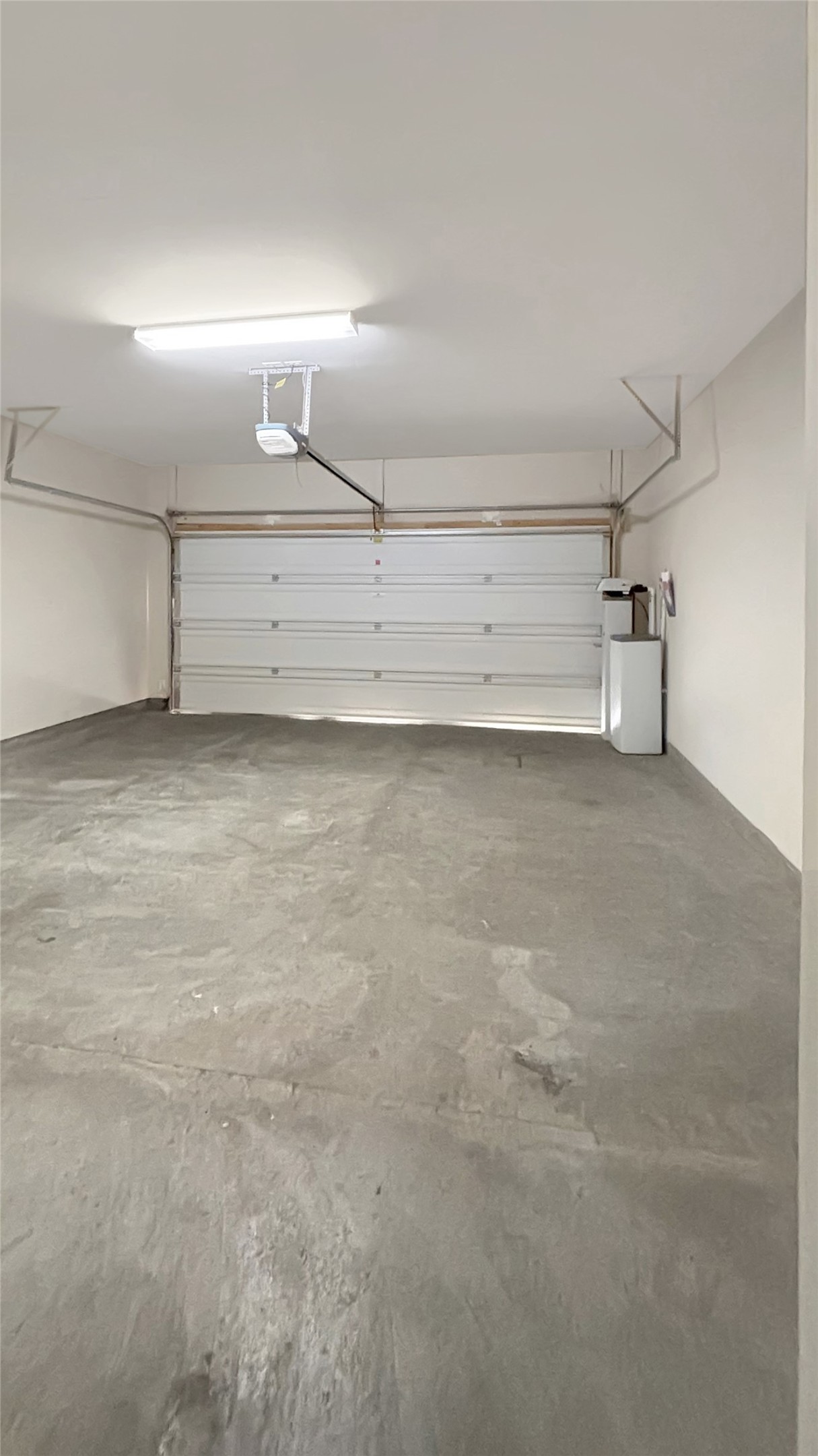 133 Langtry Lane Jarrell, TX 76537 - Photo 28 of 28 View of garage: including water softener and sprinkler system.