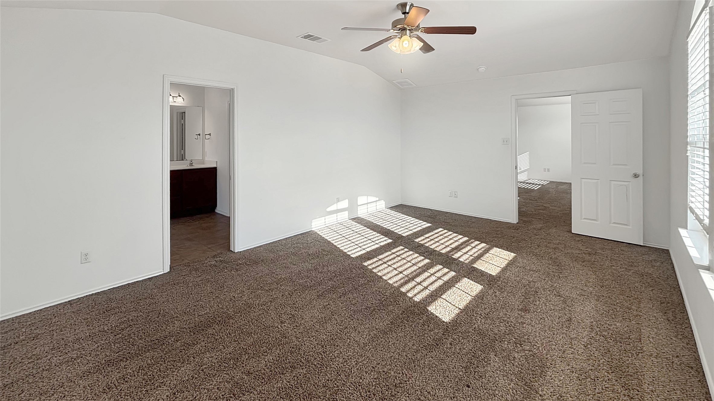 133 Langtry Lane Jarrell, TX 76537 - Photo 8 of 28 Primary bedroom view from door, check out the higher ceilings! Its on the opposite side of the other bedrooms and upper living room.