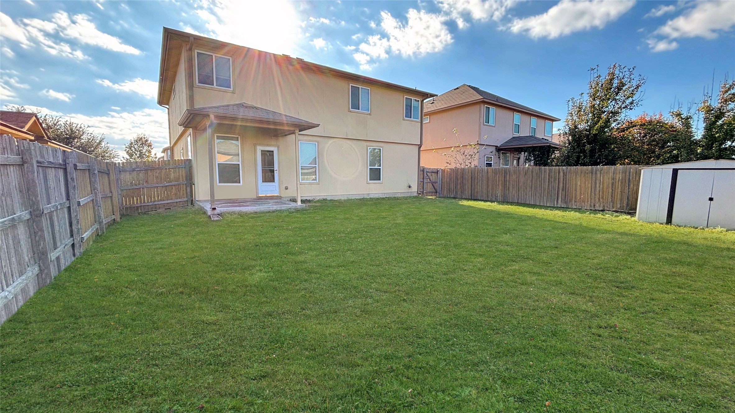 133 Langtry Lane Jarrell, TX 76537 - Photo 10 of 28 Large yard with view of the back of the house and check out that storm door!!!