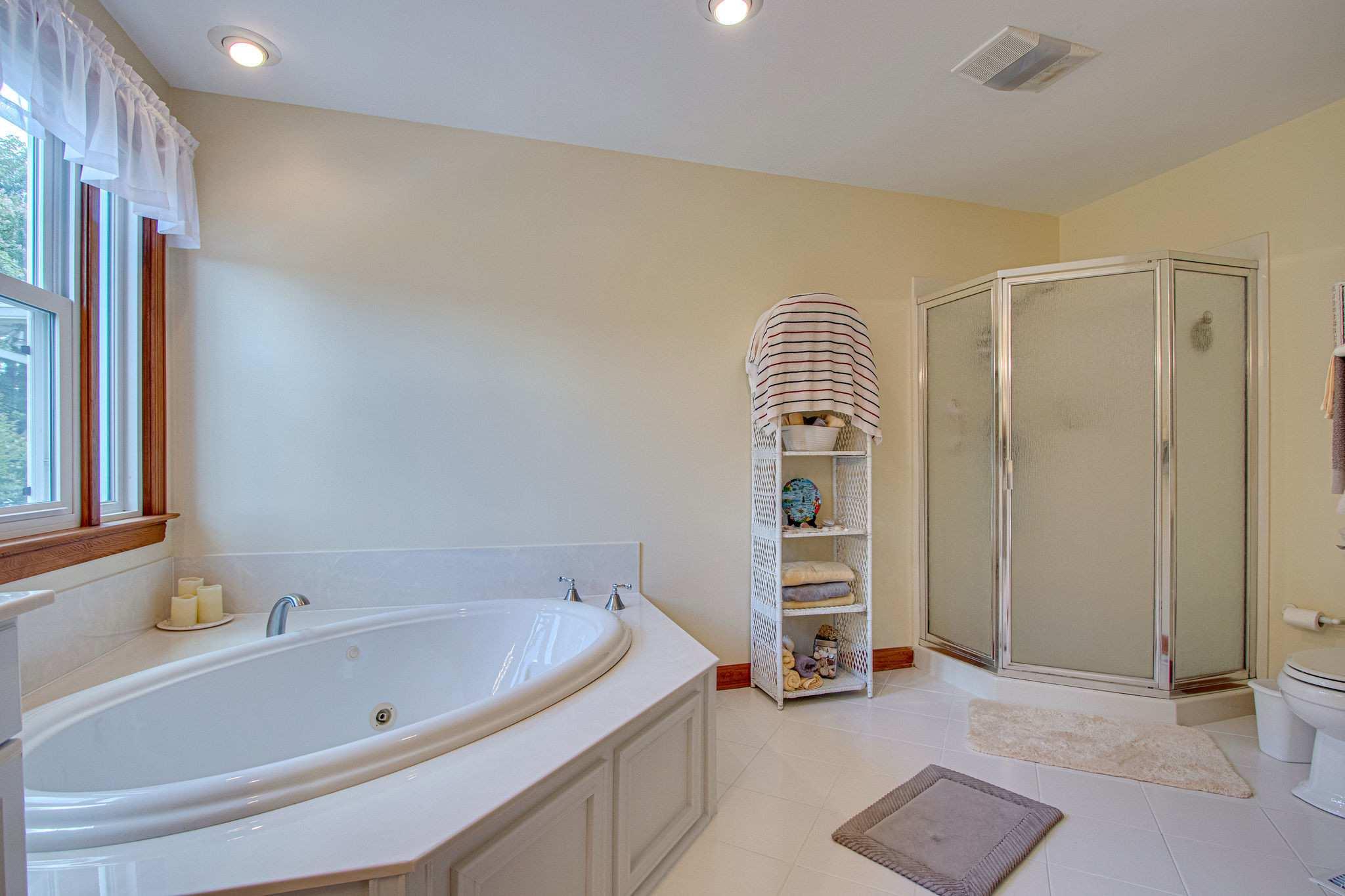 1802 Palmer Road Lebanon, TN 37090 - Photo 23 of 28 a bathroom with a bathtub and a shower